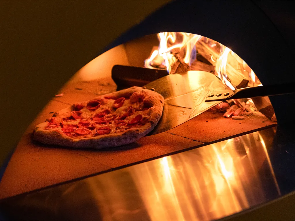 Outdoor Living Products - Alfa Pizza Ovens close-up with pizza and fire