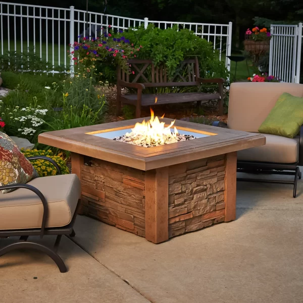 Outdoor Living Products - Fire Table with chairs on patio with garden